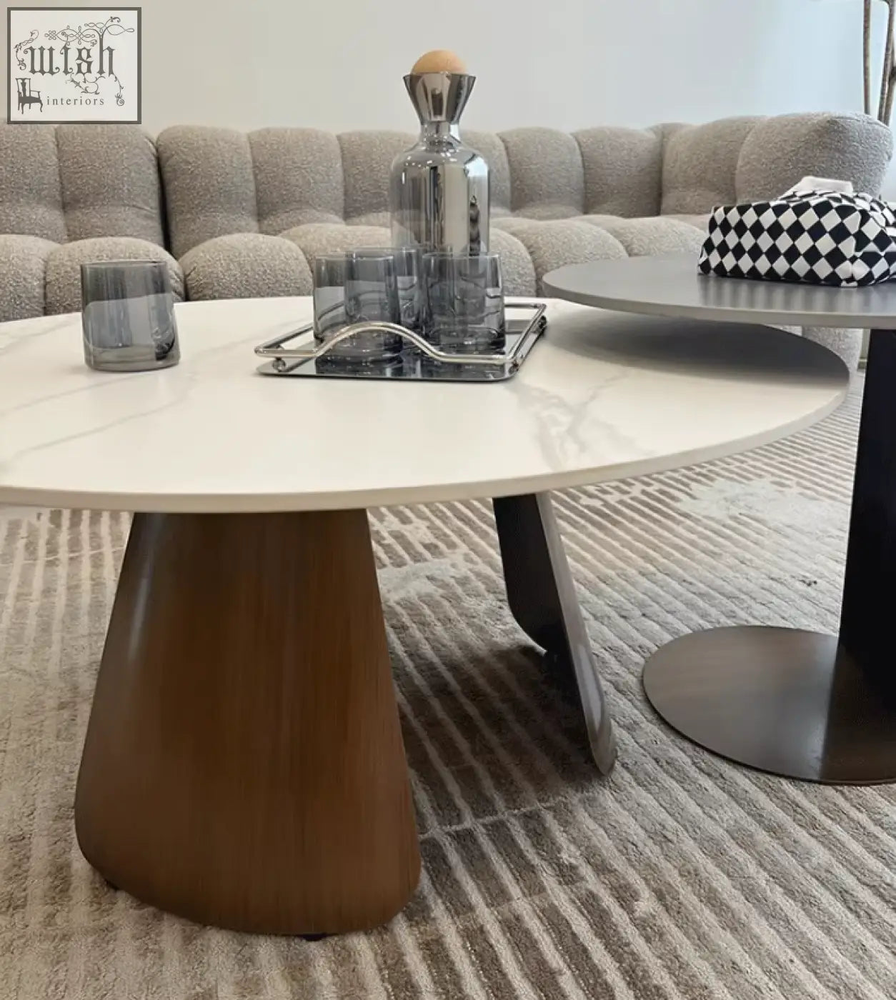 Modern oval leonor nesting coffee table with white marble top and warm brown tapered wooden base steel frame