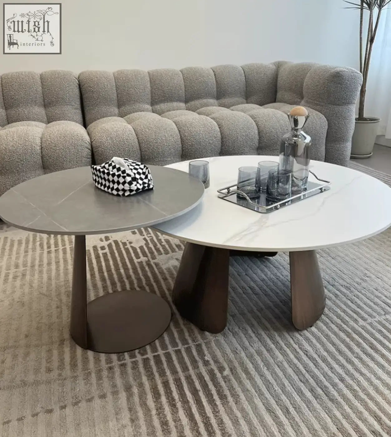 Leonor nesting coffee tables with sleek round marble tops and dark bronze steel bases for stylish living rooms