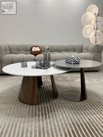 Modern leonor nesting coffee table with white marble top and dark wood steel base perfect for living rooms