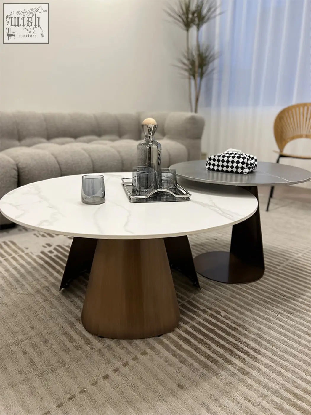 Modern round leonor nesting coffee table with white marble top and bronze steel tapered base for stylish living space