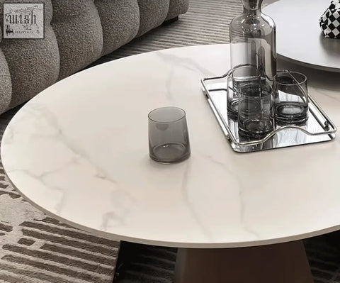 Leonor nesting coffee table with white marble patterned top and dark brown tapered legs with steel base