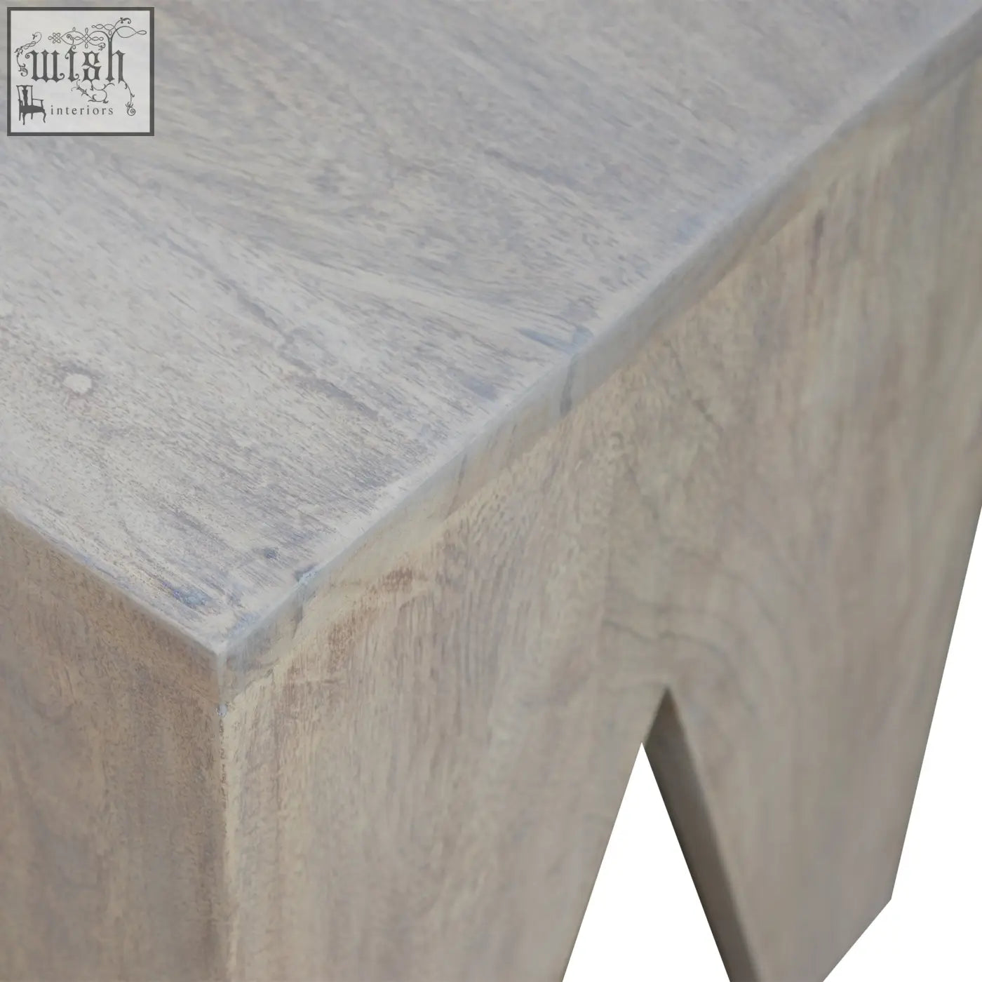 A rustic light gray wooden side table with weathered finish paired with a leopard print deep button bench