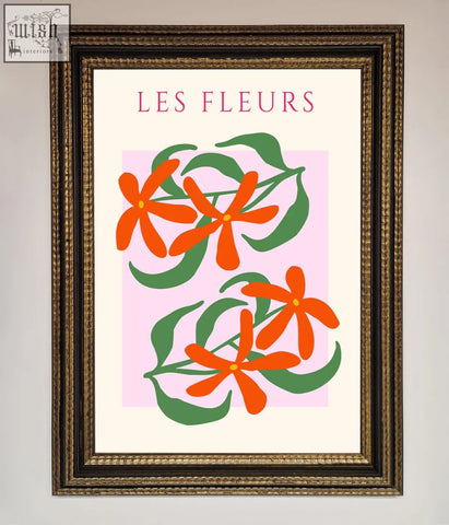 A les fleurs framed print featuring stylized orange flowers and green leaves on a soft pink background with pink lettering