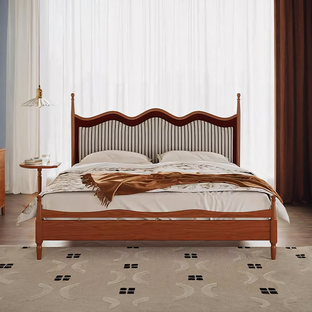Liam super king wooden bed with curved headboard and striped upholstery dressed in white linens and brown throw blanket