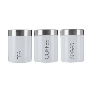 Set of three white enamel tea coffee and sugar canisters with satin stainless steel lids labeled tea coffee sugar