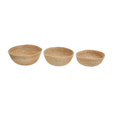 Set of three natural jute baskets made of woven seagrass with rounded shapes and textured surfaces for stylish storage