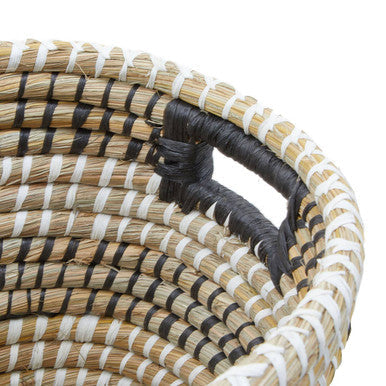 Handwoven three oval straw baskets with natural fibers black and white striped pattern and sturdy handles