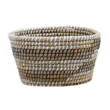 Handwoven lidi set of three oval straw baskets in natural beige brown and white earthy tones