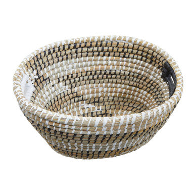 Handwoven three oval straw baskets with natural beige and white stripes made from woven fibers in the lidi set