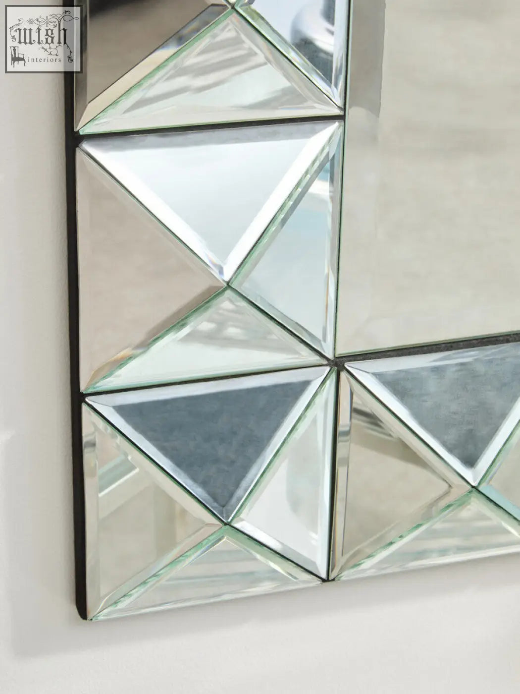 Lidia 3d effect rectangular wall mirror with triangular mirrored panels creating a faceted 3d effect pattern