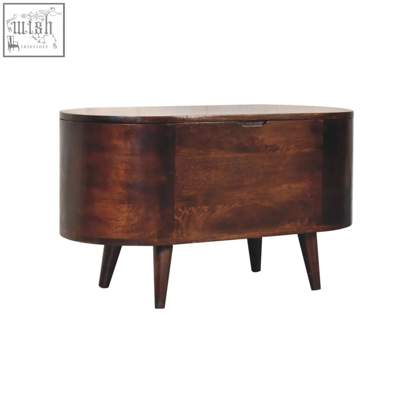 Dark brown wooden oval side table with tapered legs and single drawer next to a light walnut rounded lid-up blanket box storage bench