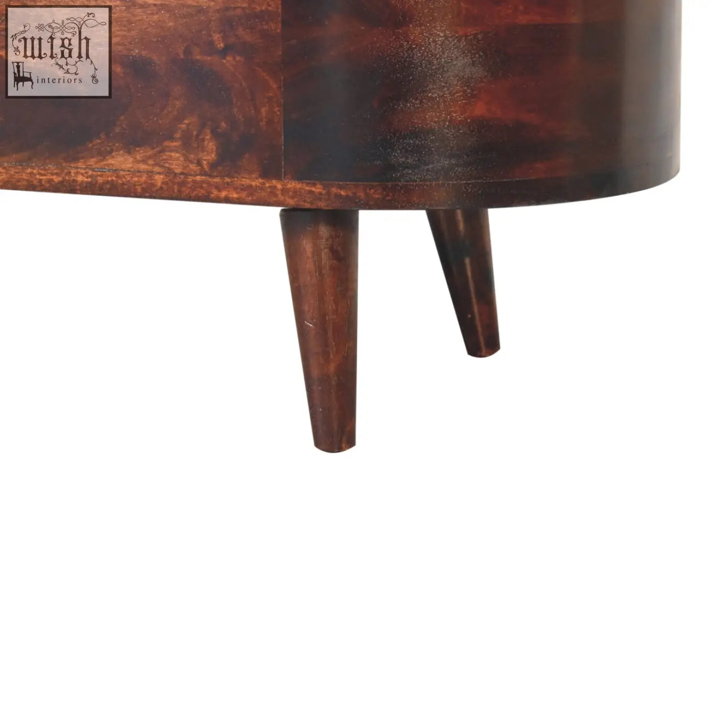 Dark brown wooden side table with tapered legs and smooth polished finish next to light walnut rounded lid-up blanket box