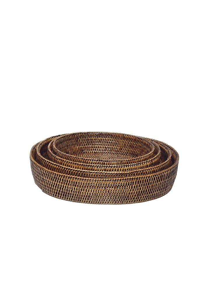 Set of three nested lil oval rattan bowls in natural brown oval woven trays perfect for serving or decor