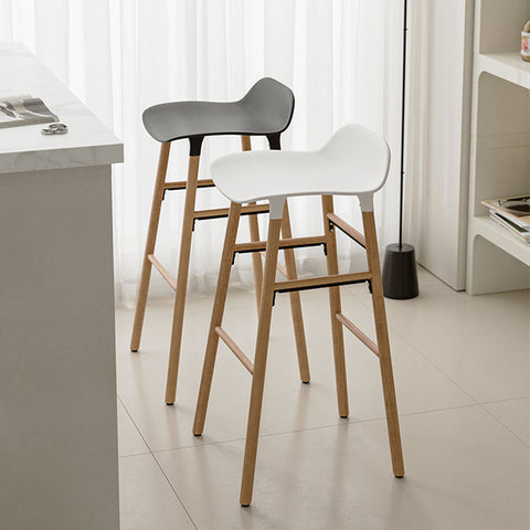 Lila Sketchy bar stool with modern white and gray curved plastic seats and light wood legs for stylish seating