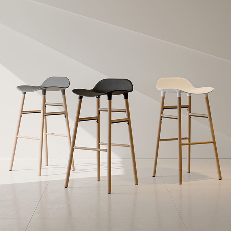 Three modern lila sketchy bar stools with curved gray black and cream seats and light wood legs