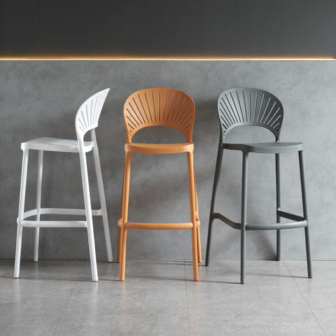 Three lilith bar stools in white orange and gray with sleek molded plastic fan-shaped backrests
