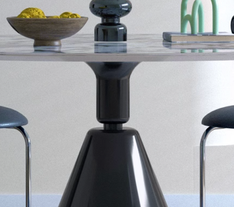 Black glossy conical metal base of the modern lillian round dining table for a stylish round dining table look