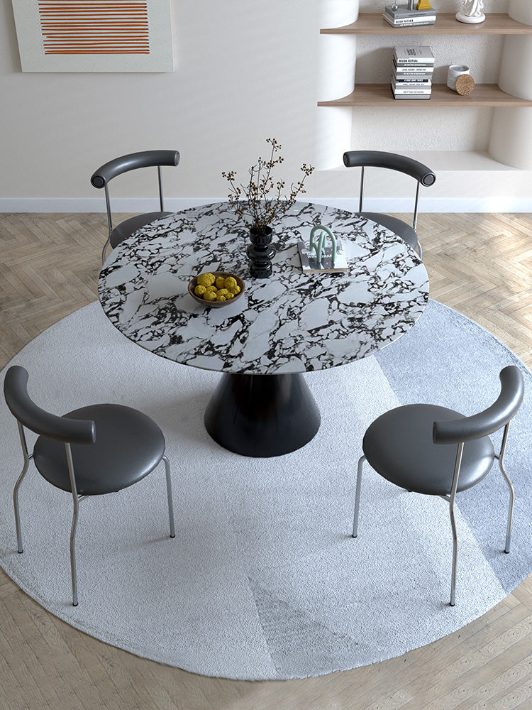 Black and white marble patterned lillian round dining table with sleek black pedestal base perfect as a dining table