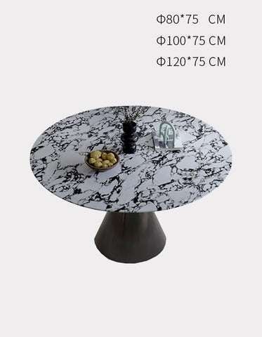 Lillian round dining table with a white and black marble patterned top and sleek dark metallic base dining table
