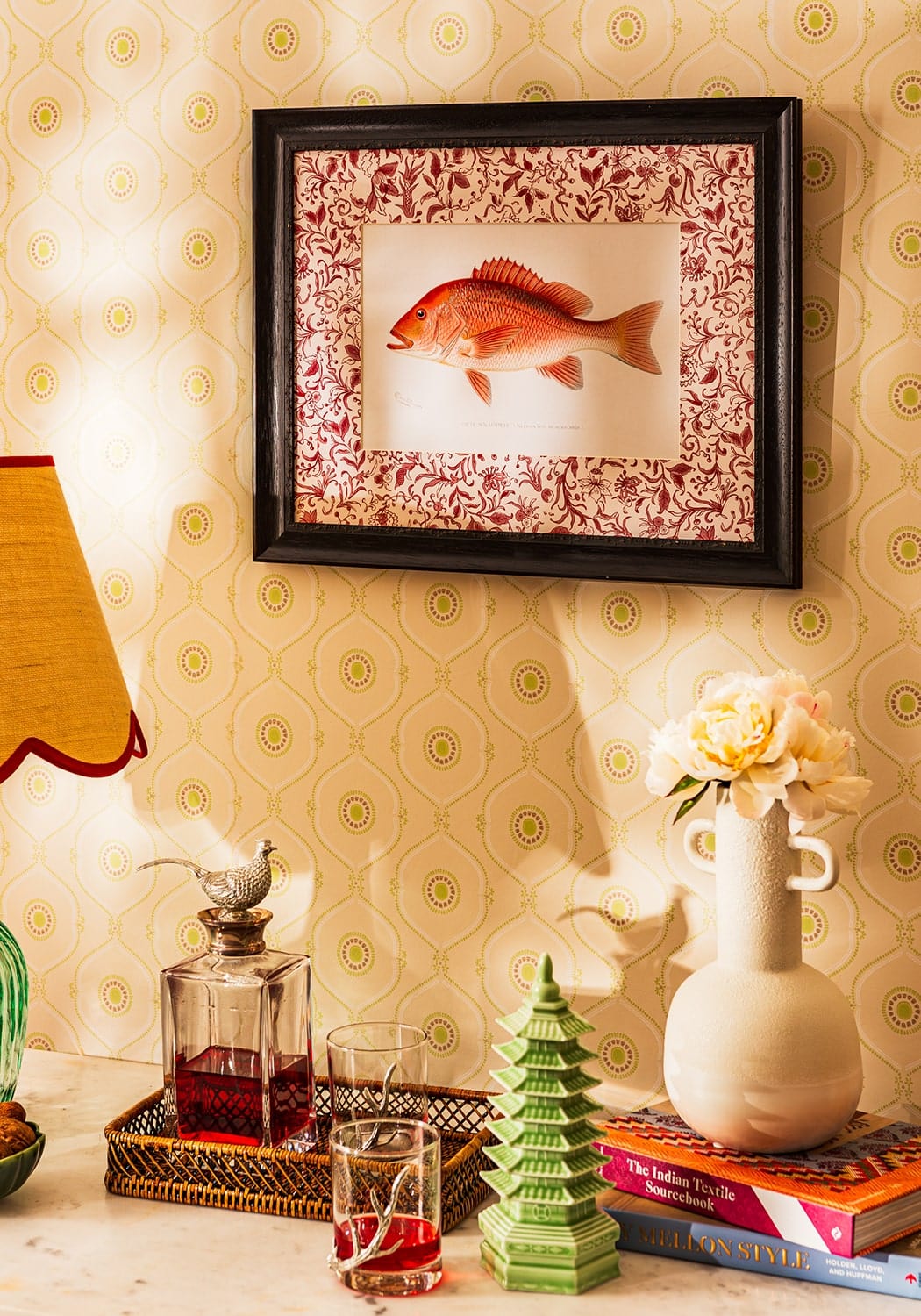 A framed botanical illustration featuring a red fish with floral patterns in a black frame for lilliana minimalist bottle vase