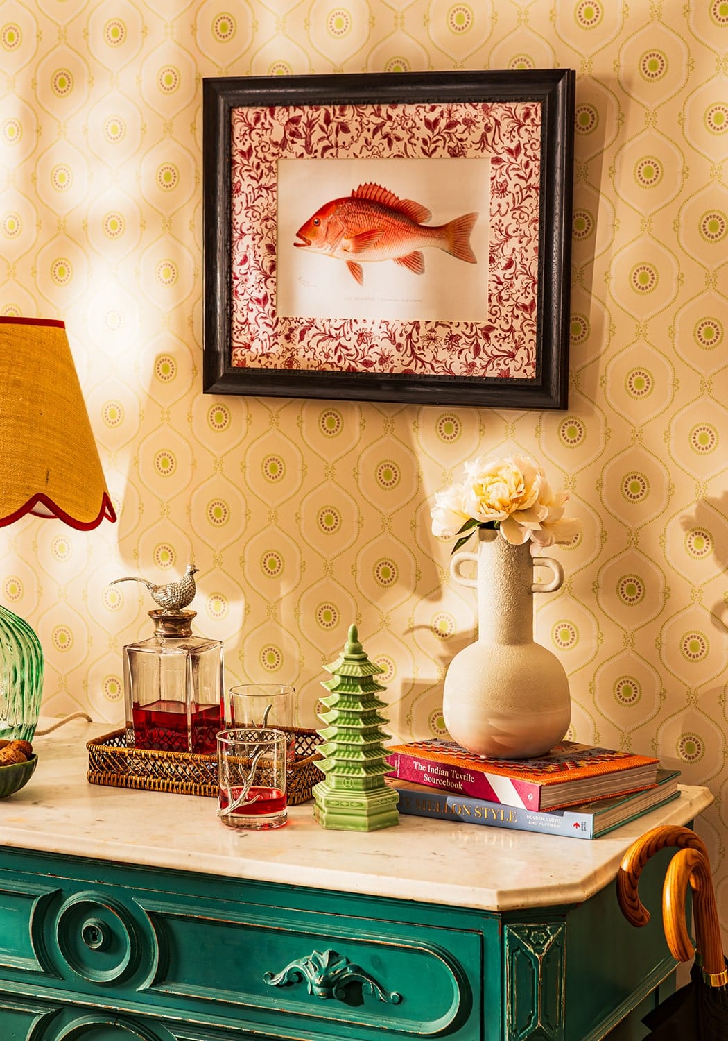 A framed illustration of a red fish with floral border in a black frame perfect for lilliana minimalist bottle vase decor