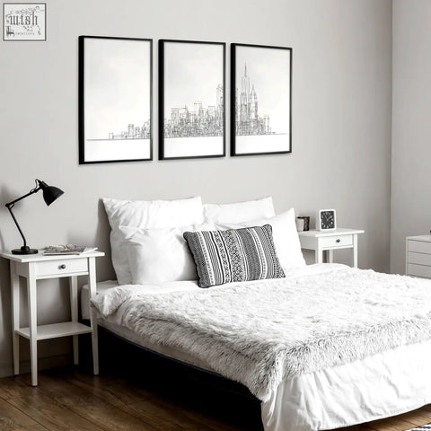 Black-framed city skyline line art prints with minimalist white backgrounds displayed as a triptych wall art set of 3