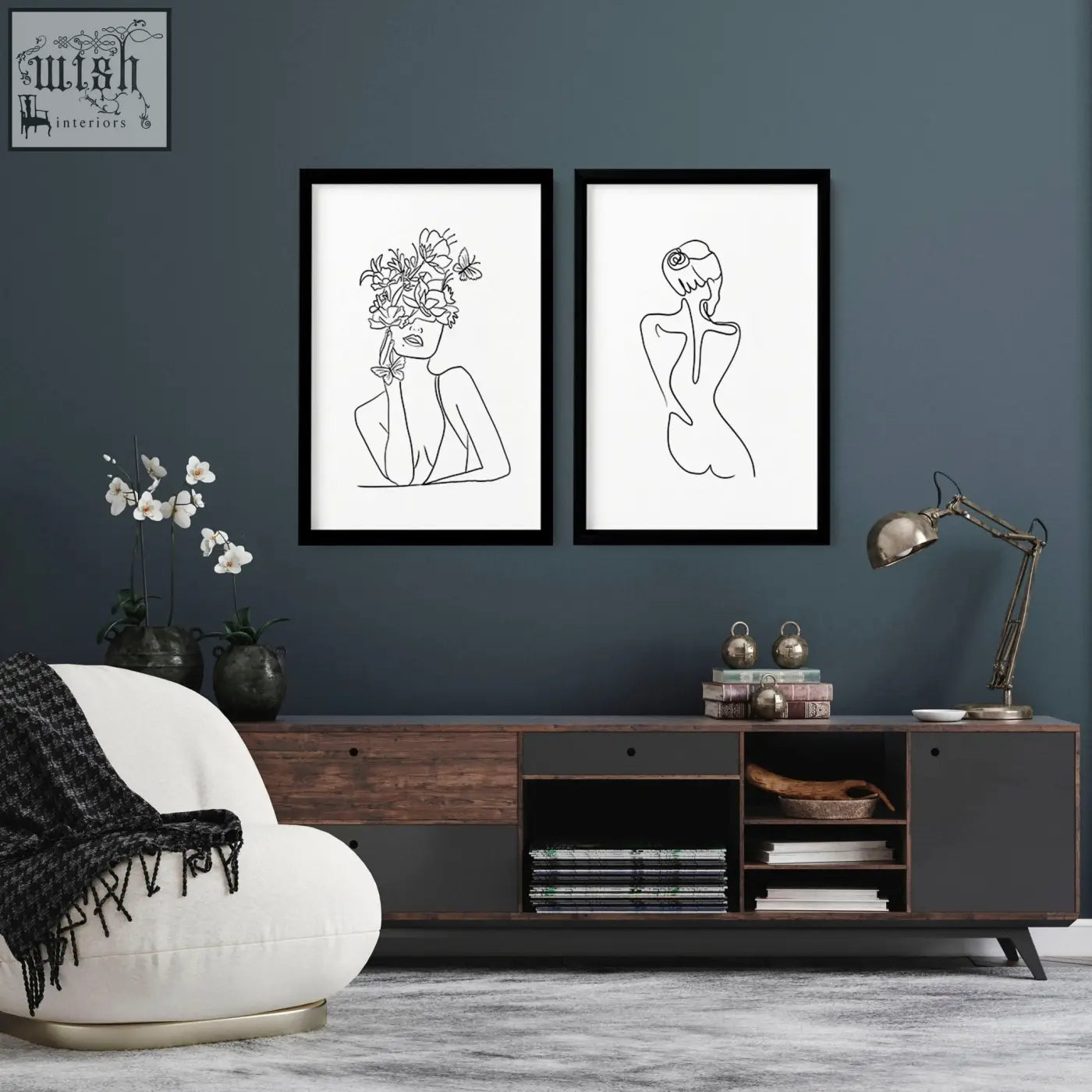Two black-framed line drawings art prints featuring minimalist feminine figures for stylish living room decor