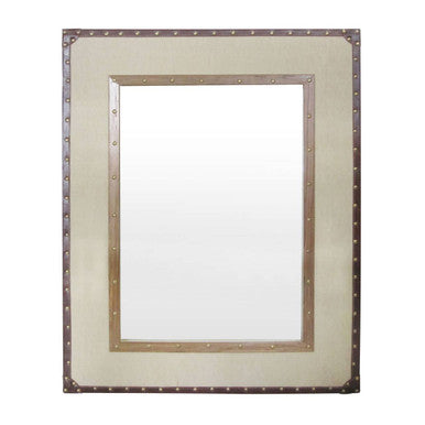 A rectangular wall mirror with a cream linen and cotton frame accented by metallic rivets and a central mirrored panel