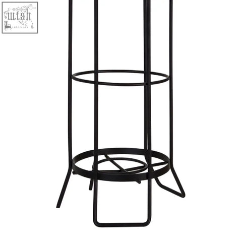 Black metal wireframe linnea toilet roll holder with three circular shelves for black toilet roll storage and display