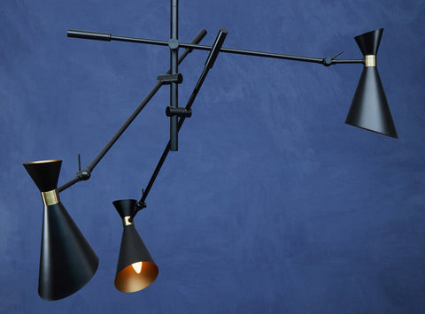 Linox 3 shade black and gold pendant featuring black conical shades with gold accents and articulated arms