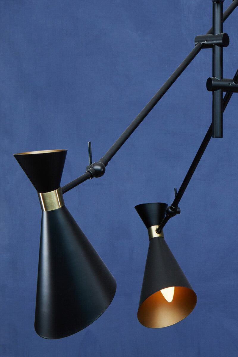 Black conical pendant lights with brass accents and adjustable arms from the linox 3 shade black and gold pendant