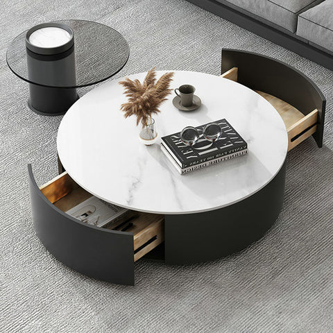 Modern round nesting coffee table set with white marble top black curved sides and light wood open drawers