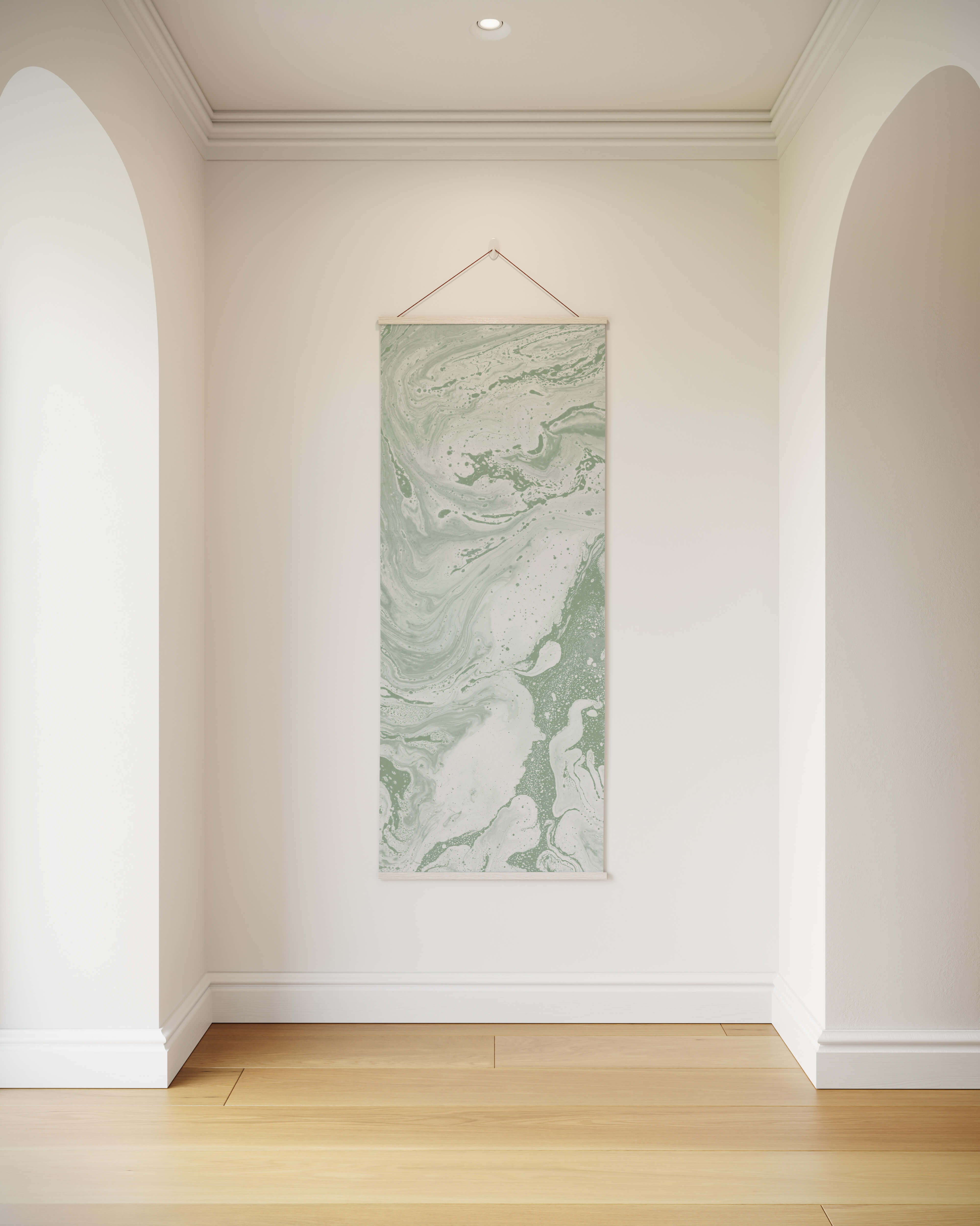 A vertical liquid marble tapestry wall hanging with soft green and white marbled pattern suspended by a wire hanger