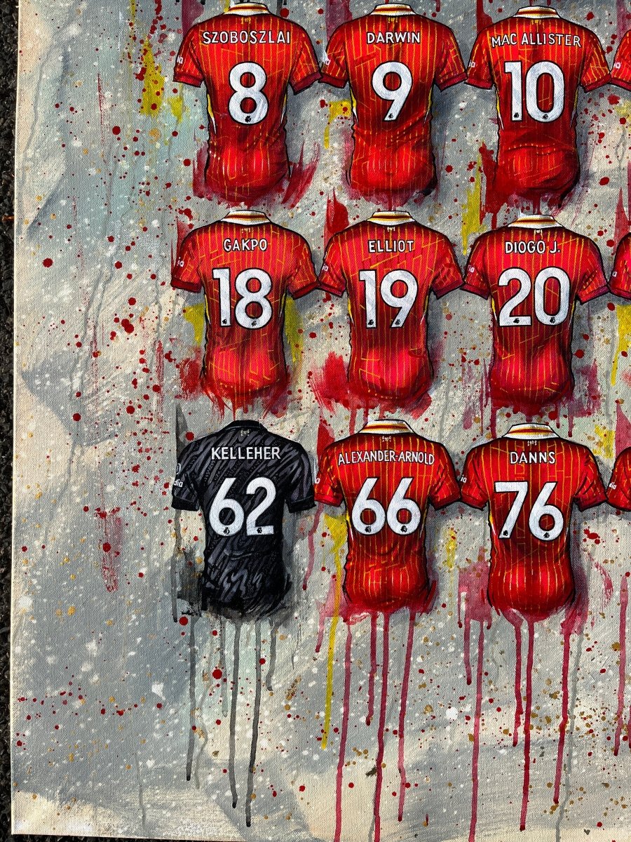 Framed print of a vibrant red and black manchester united football jersey art with player names on splattered background