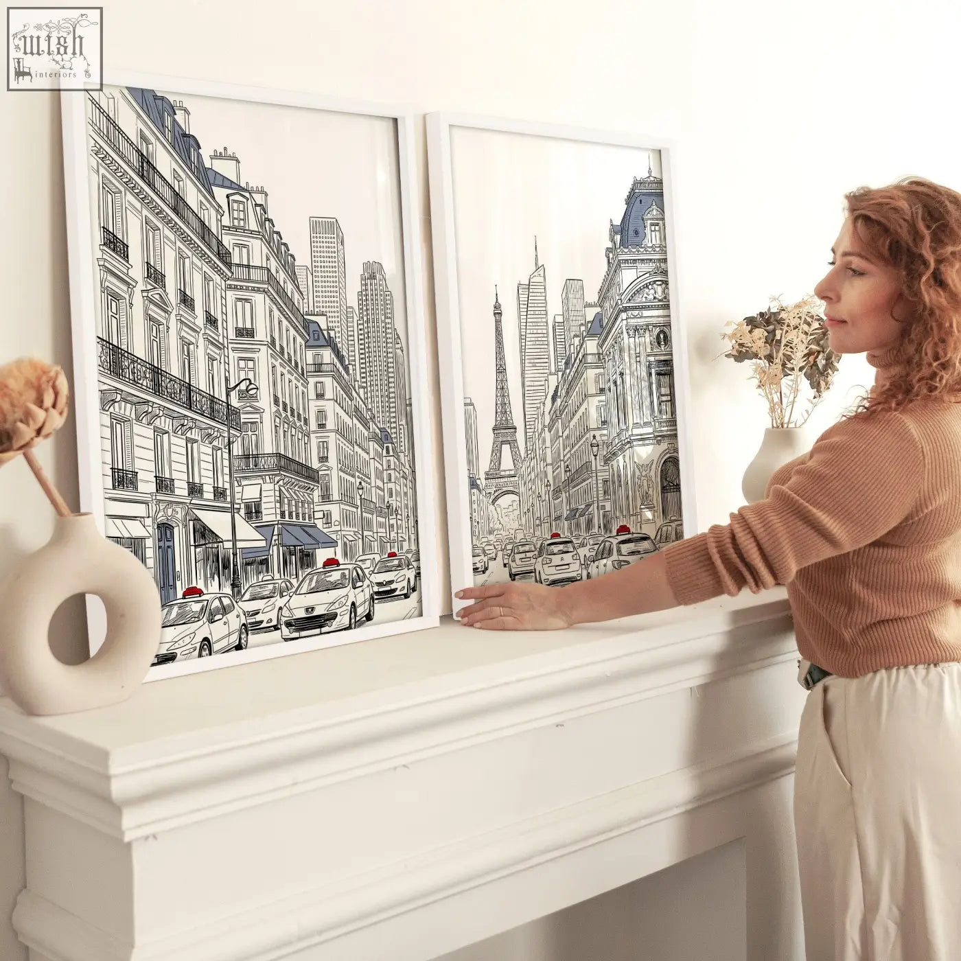 Two framed black and white paris street scene sketches in white frames perfect for living room art pictures