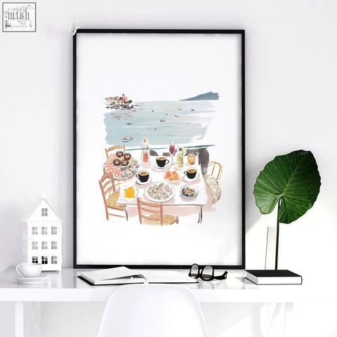 Black-framed watercolor print of mediterranean coastal seaside dining in pastel hues perfect for living room artwork