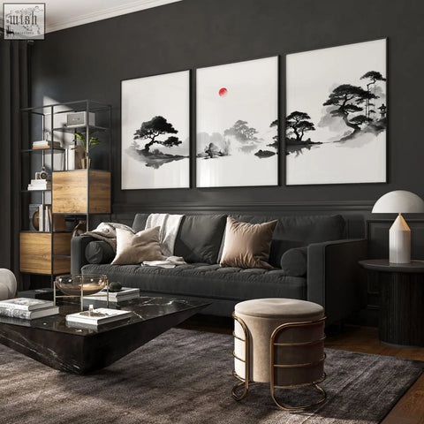 Three-panel black and white ink wash living room picture with red sun and pine trees above sofa