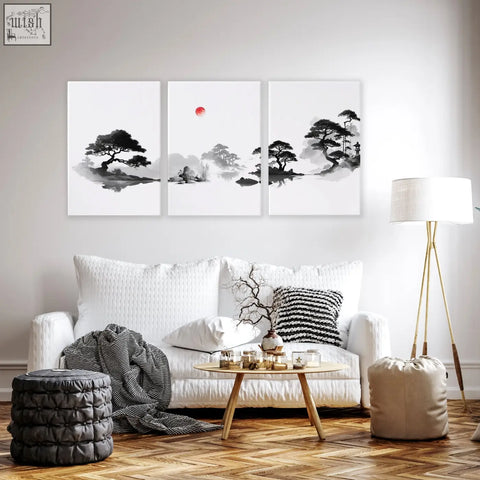 Three-panel minimalist ink wash living room picture with black and white pine trees and a red sun centerpiece
