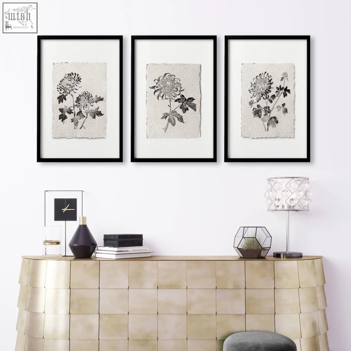 Three black-framed living room prints of botanical chrysanthemum ink illustrations on textured beige paper set of 3