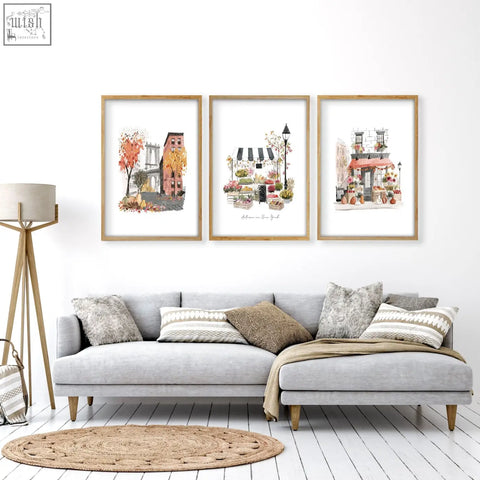 Three framed autumn in new york watercolor prints in light wood frames with white matting for living room wall art