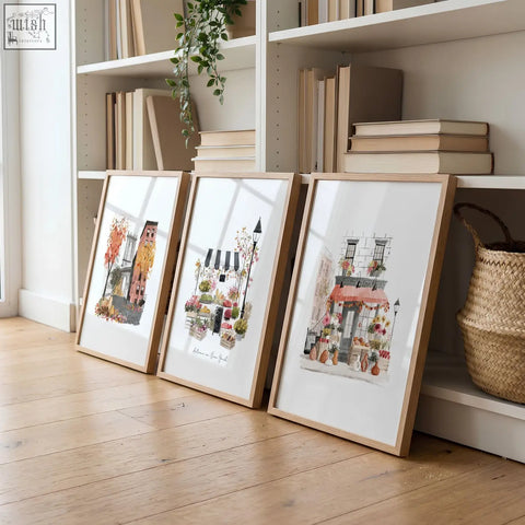 Three framed pastel parisian watercolor prints in light wood frames perfect as living room wall art set of 3