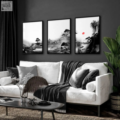 Three framed japanese ink landscape wall art with red sun black white colors above white sofa for living room wall
