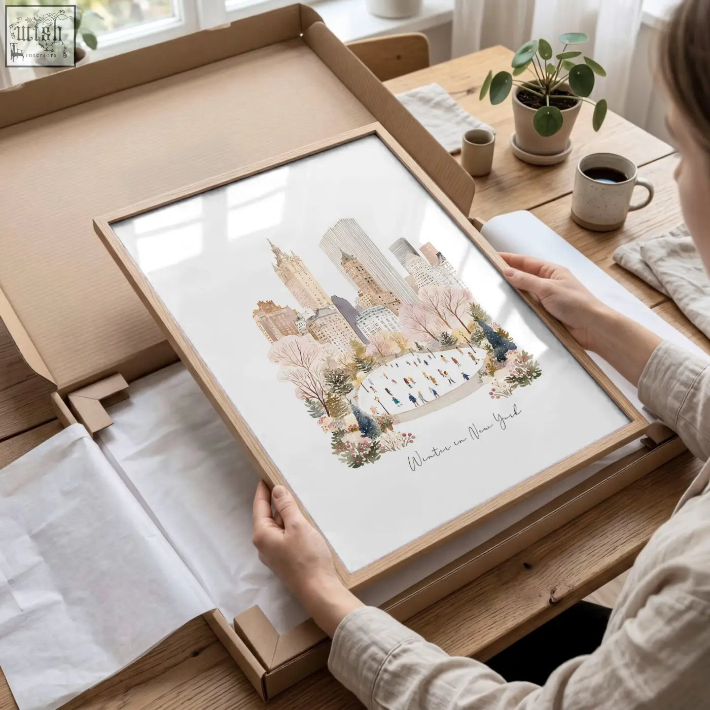 A framed beige watercolor nyc skyline with blossoming trees and people perfect as living room wall art