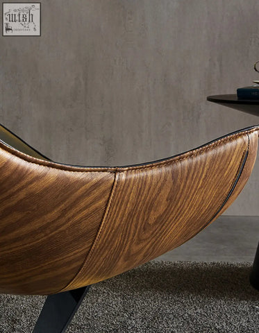 Brown faux leather lobster lounge chair with wood grain pattern and black stitching for a stylish lounge chair