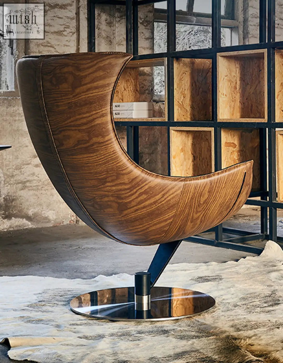 Brown leather lobster lounge chair with sleek curved design and metallic base perfect for relaxing in style