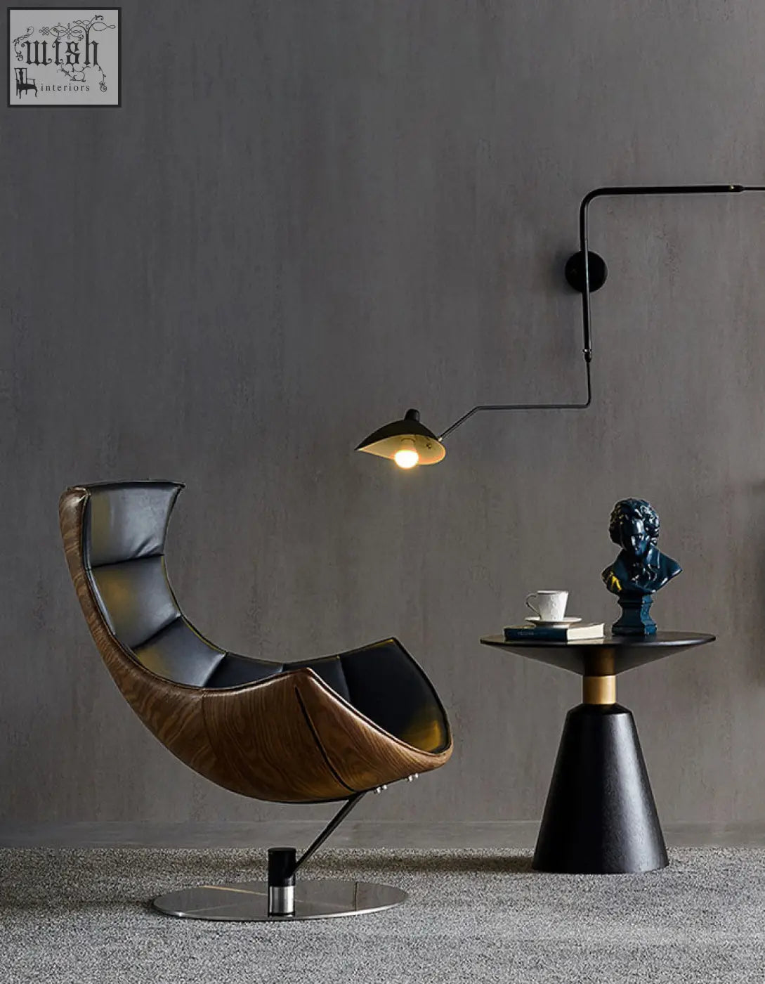 Modern curved lobster lounge chair in black leather with sleek minimalist design and dark brown upholstery