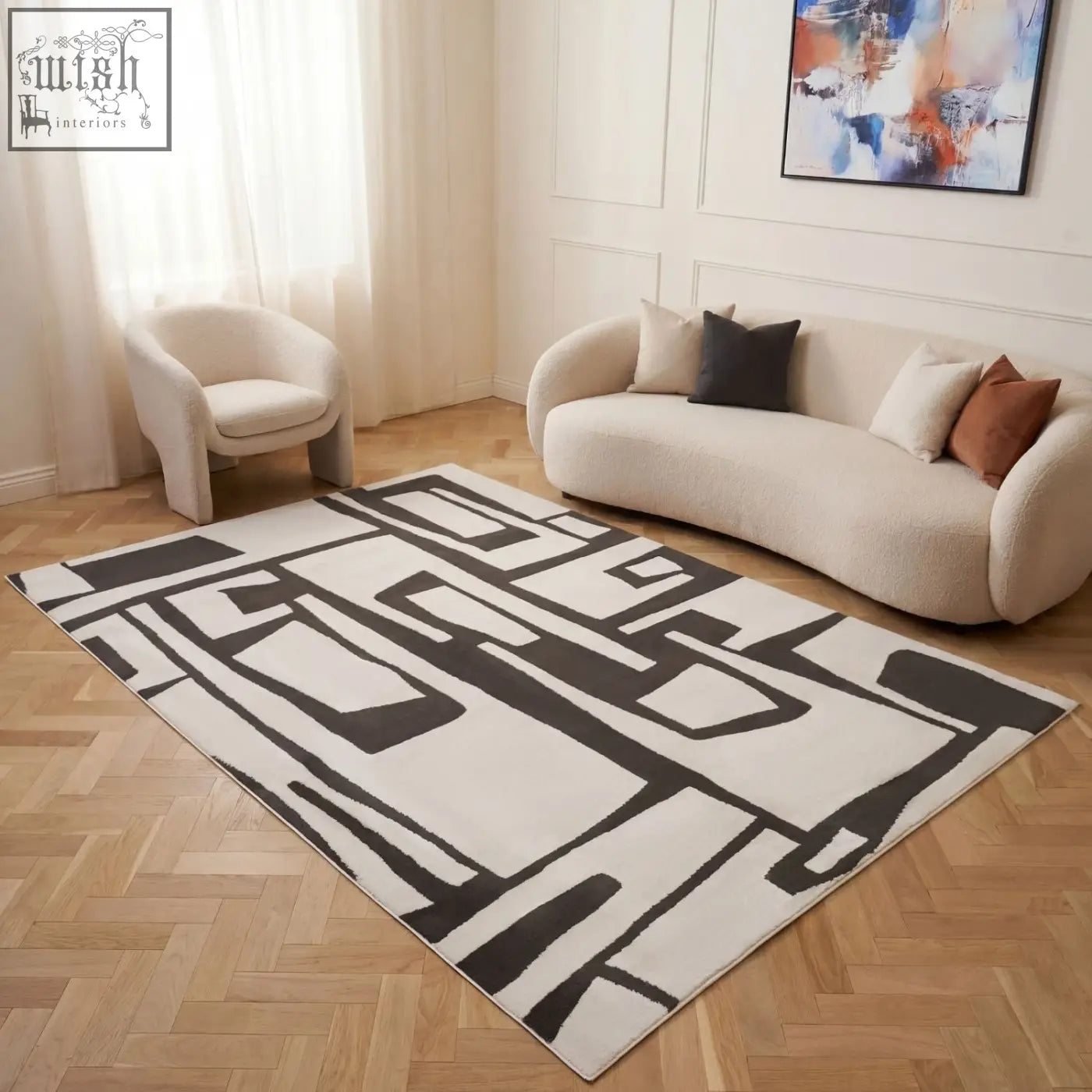 Modern geometric loft abstract dark grey rug with bold black and cream patterns on a light wood floor