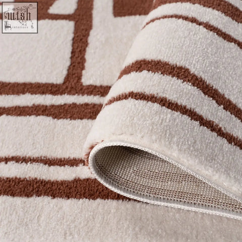 Cream-colored loft abstract terra rug with brown geometric stripes and plush textured surface perfect for cozy spaces