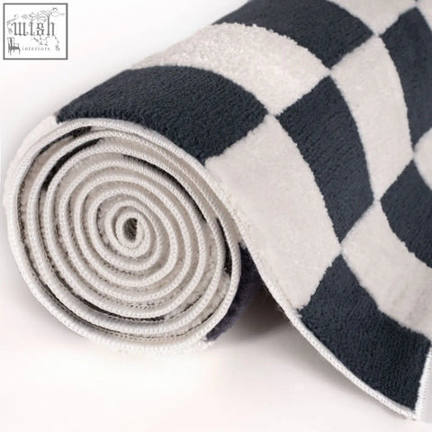 A plush blue rug with a loft checkerboard blue pattern and soft textured fabric perfect for cozy spaces