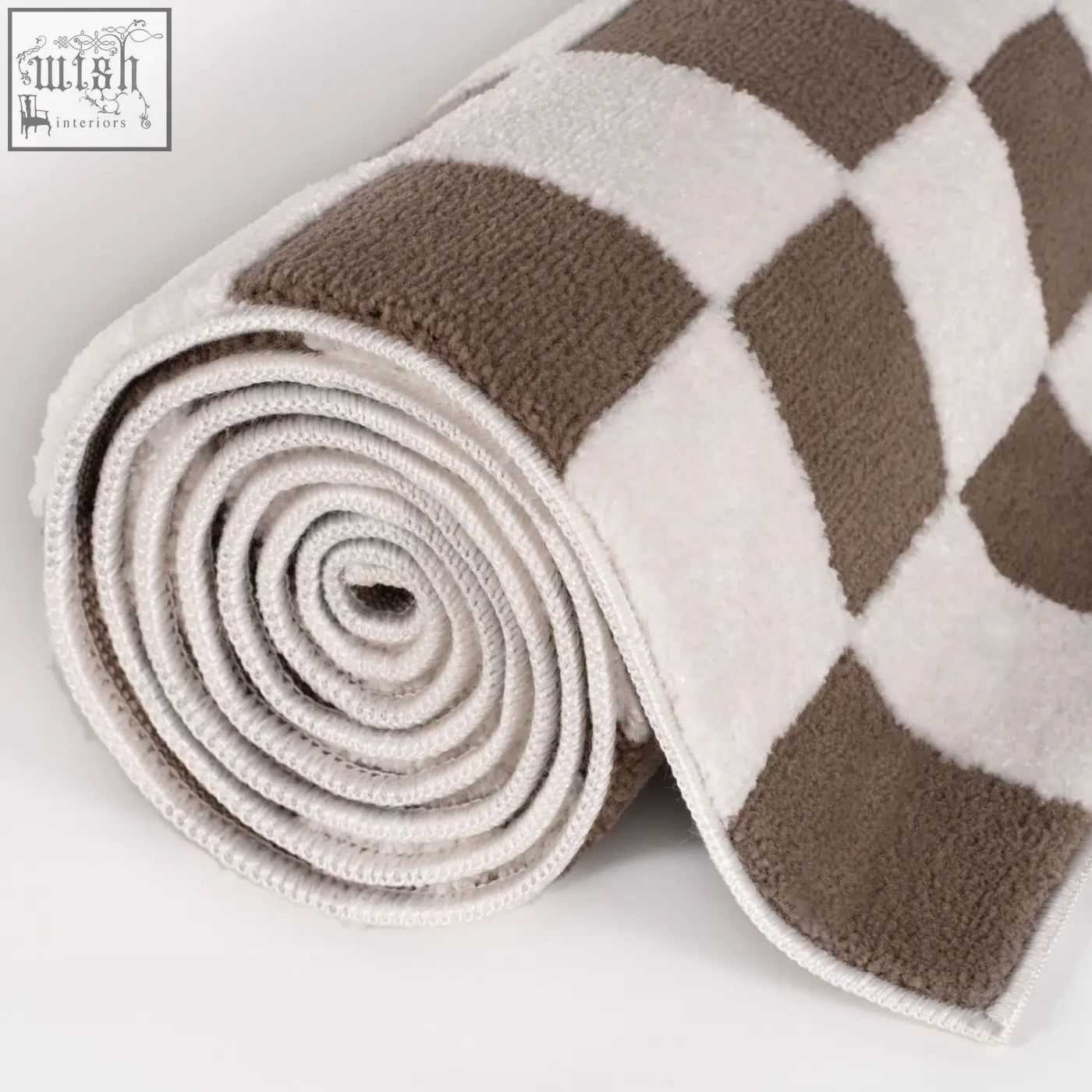 A plush rolled loft checkerboard brown rug with a soft beige and taupe checkered pattern perfect for any room